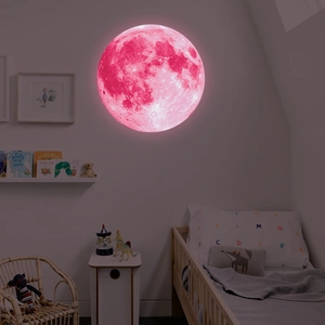 Macro detail of a 30cm pink luminous moon wall sticker with realistic crater textures