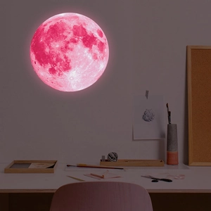 Detailed close-up of pink glowing 30cm moon wall sticker with lunar crater texture