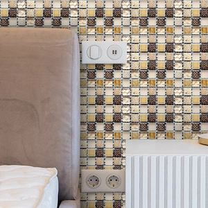 Detail showing self-adhesive brown mosaic tile wall stickers in a cozy bedroom scene