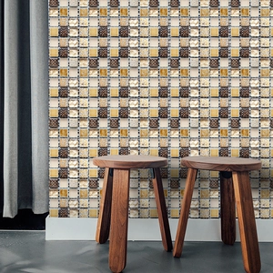Detail of self-adhesive mosaic wall tiles featuring gold and bronze textured patterns