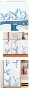DIY watercolor mermaid tail wall stickers shown applied to bathroom and cabinet surfaces