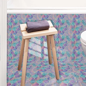 Detail of waterproof purple fish scale tile stickers with gold trim in a bathroom setting