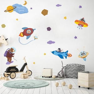 Space exploration wall decals featuring cartoon animals in rockets and colorful planets