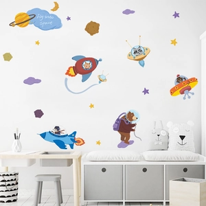 Cartoon space astronaut animals wall decals for nursery room featuring rockets and planets