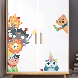 Detail showing watercolor animal wall stickers with fox and lion on a white wooden wardrobe