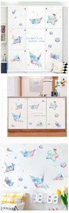 Detailed view of watercolor paper crane and planet wall stickers for kids' room decoration