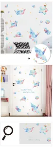 Detail view of watercolor origami crane and star wall stickers for nursery DIY decor