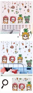 Detail display of cute cartoon cats with fruit hats and ice cream stickers on a wall