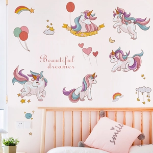 Whimsical unicorn wall decals with rainbows and stars for a dreamy girl's bedroom decor