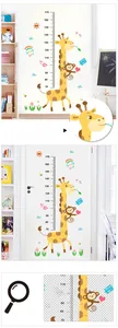 Detailed view of height growth chart with giraffe and monkey cartoons for kids' room