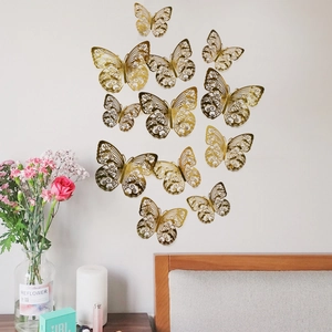 Set mit 12 goldenen Hohlkörper-Schmetterling-Wandstickern für Schlafzimmer-Deko