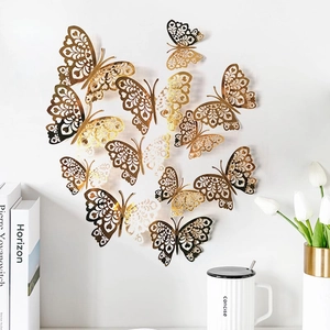 Detailed macro view of 3D gold hollow butterfly wall decals in a heart arrangement