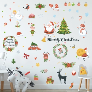 Cozy nursery setting featuring colorful Santa and Christmas tree wall stickers on a white wall