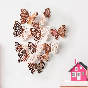 Rose gold 3D hollow butterfly wall stickers with intricate paper cut patterns for decor
