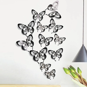 Detailed view of 12-piece black and white 3D hollow butterfly wall decals for home decor