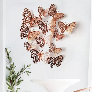 Detailed view of 3D rose gold hollow butterfly wall stickers with intricate laser-cut patterns