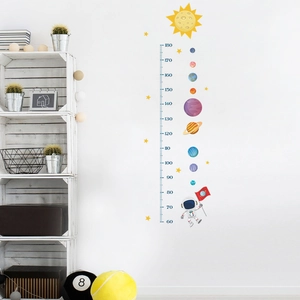 Close-up of astronaut wall sticker with clear 60-180cm growth chart for kids