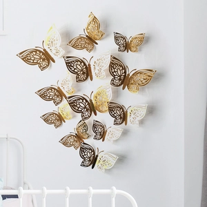Detailed 3D hollow butterfly wall stickers in gold and white with floral laser cut patterns