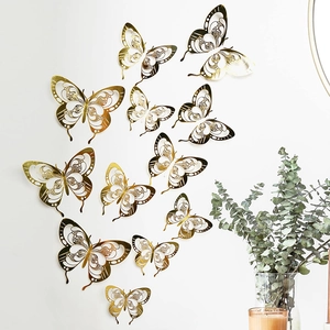 Detailed view of golden 3D hollow butterfly wall stickers with laser-cut metallic finish