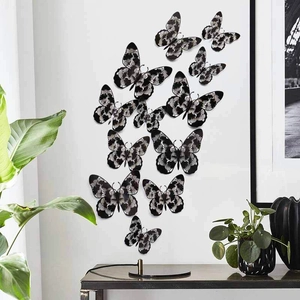 Detail of 3D cutout butterfly wall stickers with vintage patterns in a modern home decor setting