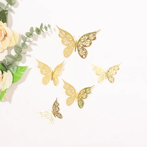 Detailed close-up of golden hollow butterfly wall stickers with mirror metallic finish