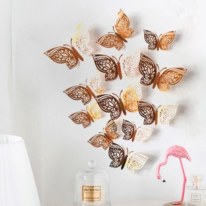 Detailed view of 3D hollow butterfly wall stickers in gold and copper for home decor