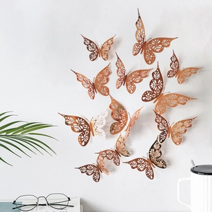 Detailed 3D hollow butterfly wall stickers in rose gold finish with 12 pieces per set