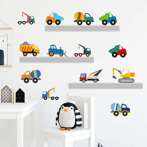 Detailed view of colorful cartoon construction truck wall stickers in a child bedroom setting