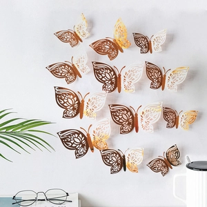 3D hollow laser-cut butterfly wall stickers in gold and white for home decor