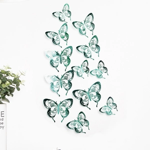 Detail of 3D hollow butterfly wall stickers with intricate laser-cut patterns in gradient green