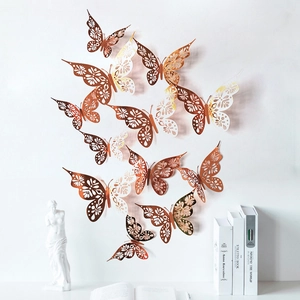 Detailed view of 3D rose gold hollow butterfly wall stickers in a minimalist room