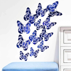 3D hollow deep blue butterfly wall stickers with intricate white floral patterns on white wall