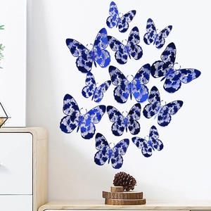 Detailed view of 3D navy blue hollow butterflies on white wall with laser-cut patterns