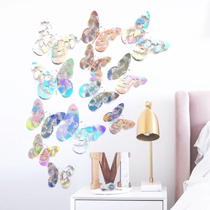 Detail of 12pcs iridescent hollow-out butterfly wall stickers on bedroom wall
