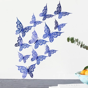 Detailed laser-cut blue 3D butterflies with hollow patterns for creative wall decor
