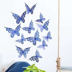 Detailed view of dark blue 3D hollow butterfly wall stickers in a home interior setting
