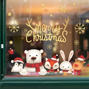 Merry Christmas window stickers featuring golden stars and cute cartoon animals on glass
