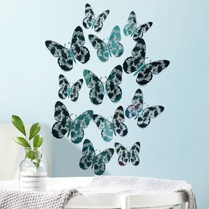 Detail of 3D cutout butterfly wall stickers in dark green and peacock blue tones