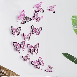 Pink and purple 3D hollow butterfly wall stickers displayed on a white wall decor