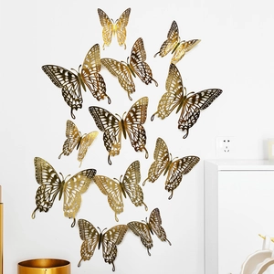 Detail view of 12pcs golden hollow-out 3D butterfly wall stickers with intricate patterns
