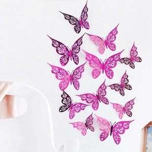 Detailed laser-cut hollow pattern on 3D metallic butterfly wall stickers in purple hues