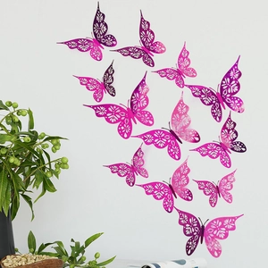 Detailed view of 12 pink purple hollow paper butterflies arranged on a minimalist white wall