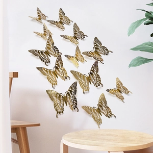 Detailed view of 12pcs 3D gold hollow butterfly wall stickers with folded wings for decor