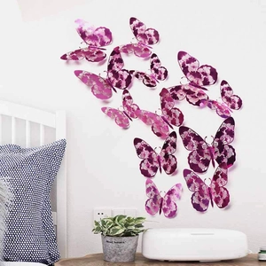 Close-up of 3D purple butterfly wall stickers with floral hollow patterns for home decor