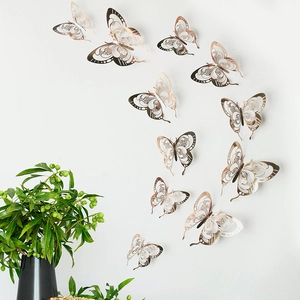 Detailed view of rose gold 3D hollow butterfly wall stickers with laser-cut patterns
