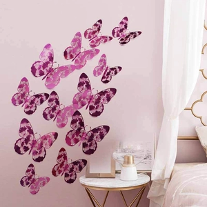 Detailed 3D butterfly wall stickers with intricate hollow patterns on a soft pink wall