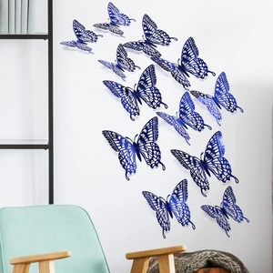 Detailed close-up of sapphire blue 3D hollow butterfly wall stickers with metallic finish