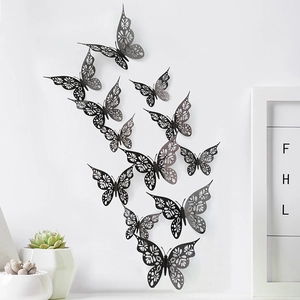 Detail of 12pcs dark grey hollow 3D butterfly wall stickers in a modern minimalist home setting