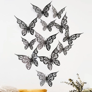 3D hollow black butterfly wall stickers with intricate laser-cut floral patterns for home decor