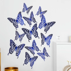 Blue 3D hollow butterfly wall stickers with metallic luster on white wall for DIY decor